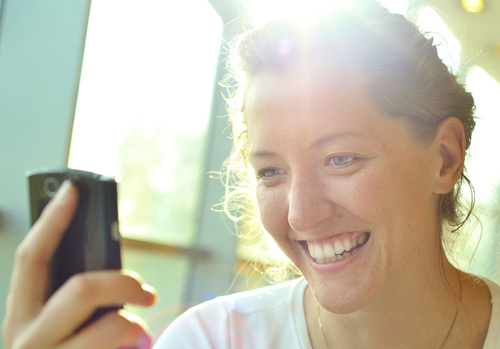 Young woman looking at her new smile