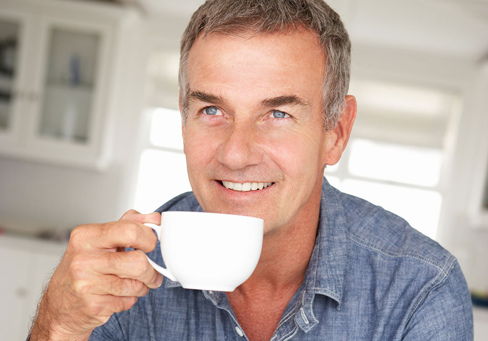 Middle aged man drinking coffee